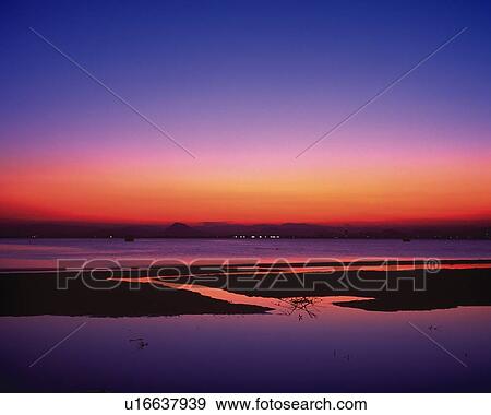 Stock Photo - Sunset at the Beach, Front View. Fotosearch