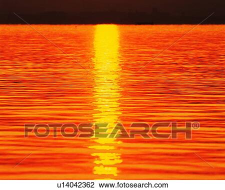 Stock Image - Sunset at the Beach, High Angle View, Pan Focus. Fotosearch