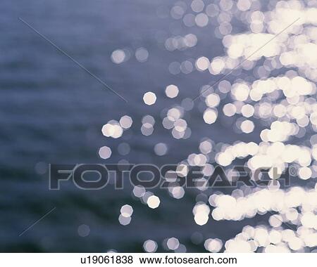 Water Surface and Sunlight, Close Up, Lens Flare, Defocused View Large Photo Image Stock Photo - Water Surface and Sunlight, Close Up, Lens Flare, Defocused. Fotosearch