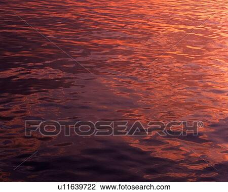 Stock Image - Water Surface and Sunset, Close Up. Fotosearch