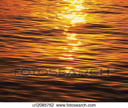 Stock Image - Water Surface and Sunset, High Angle View, Pan Focus. Fotosearch
