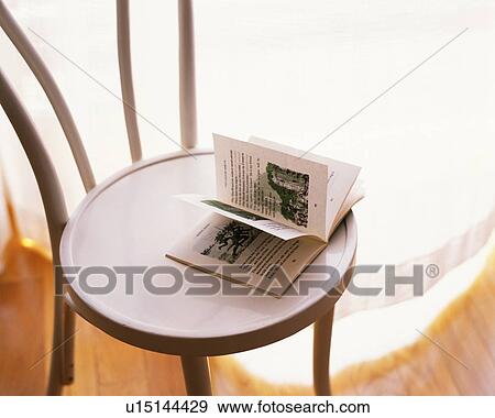 A book on a chair, Close Up, High Angle View View Large Photo Image Stock Photo - A book on a chair, Close Up, High Angle View. Fotosearch