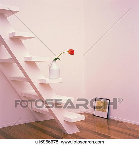 Stock Photography - A flower in the vase on the stairs, High Angle View. Fotosearch