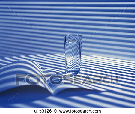 Stock Image - A glass on the table, Close Up, High Angle View. Fotosearch