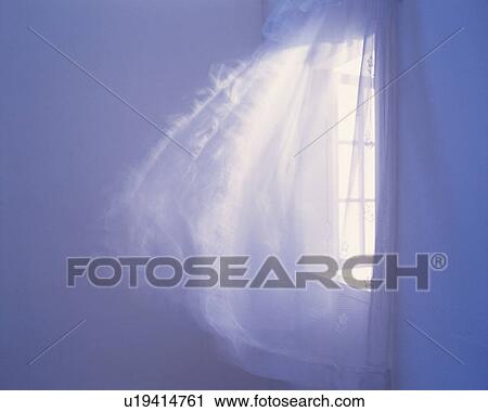 Stock Image - Curtains waving in the wind, Blurred Motion. Fotosearch