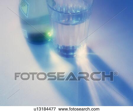 Glass and bottle of water, Close Up, High Angle View, Soft Focus, Lens Flare View Large Photo Image Stock Photo - Glass and bottle of water, Close Up, High Angle View, Soft Focus, Lens Flare. Fotosearch