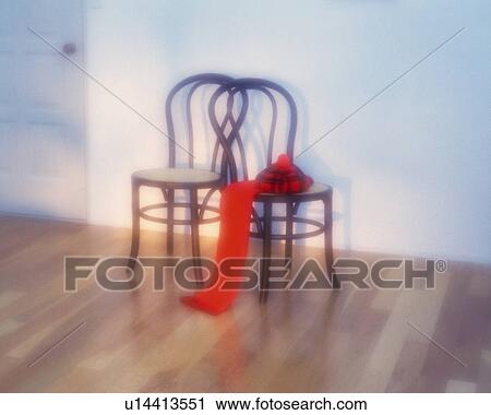 Stock Image - Knit cap and muffler on the chair, High Angle View, Soft Focus. Fotosearch