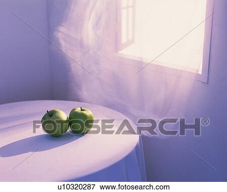 Stock Photo - Two apples on the table, Close Up, High Angle View. Fotosearch
