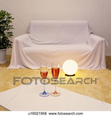 Two glasses of drink on the table, Close Up, High Angle View View Large Photo Image Stock Photo - Two glasses of drink on the table, Close Up, High Angle View. Fotosearch