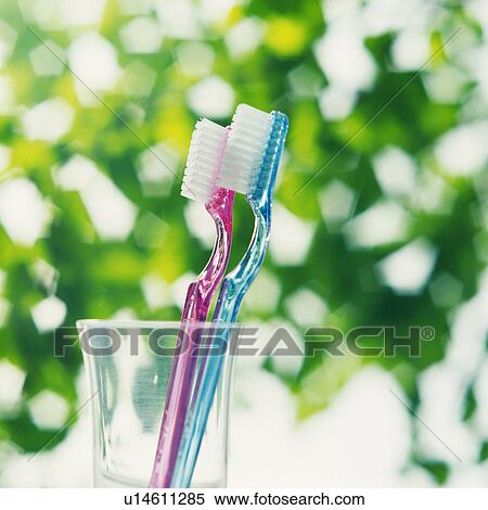 Two toothbrushes in the glass, Close Up, Differential Focus View Large Photo Image Stock Photography - Two toothbrushes in the glass, Close Up, Differential Focus. Fotosearch