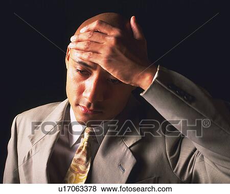 A bald headed businessman checking temperature, High Angle View View Large Photo Image Stock Photo - A bald headed businessman checking temperature, High Angle View. Fotosearch