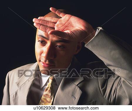A bald headed businessman putting hand on forehead, Side View View Large Photo Image Stock Photo - A bald headed businessman putting hand on forehead, Side View. Fotosearch