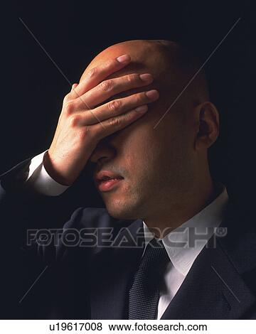 A bald headed businessmen with hand covering eyes, Side View View Large Photo Image Stock Photo - A bald headed businessmen with hand covering eyes, Side View. Fotosearch