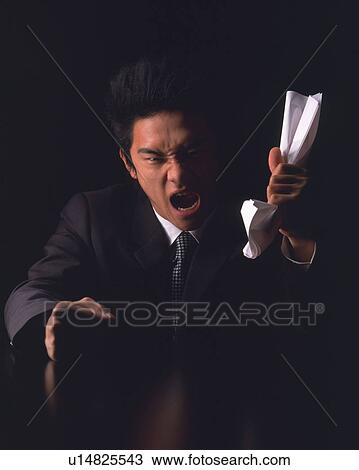 A businessman angry and crushing paper in hand, Front View View Large Photo Image Stock Image - A businessman angry and crushing paper in hand, Front View. Fotosearch