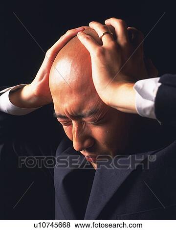 A stressed out bald headed businessman with hands on head, Side View View Large Photo Image Stock Photo - A stressed out bald headed businessman with hands on head, Side View. Fotosearch
