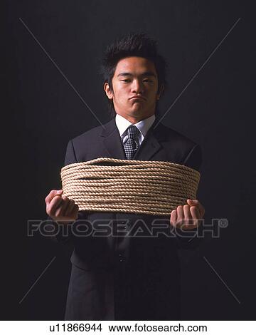 A tied up businessman, Front View View Large Photo Image Picture - A tied up businessman, Front View. Fotosearch