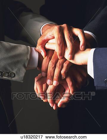 Three businessmen shaking hands, Close Up View Large Photo Image Stock Photo - Three businessmen shaking hands, Close Up. Fotosearch
