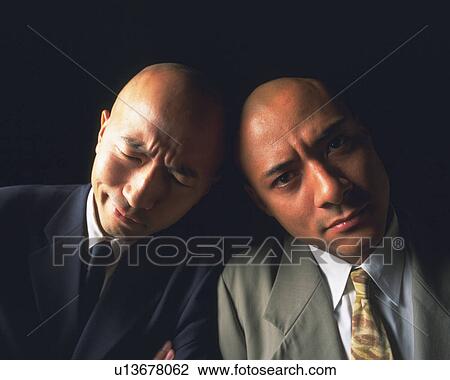 Two bald headed businessmen against each other's head, Front View View Large Photo Image Stock Image - Two bald headed businessmen against each other's head, Front View. Fotosearch