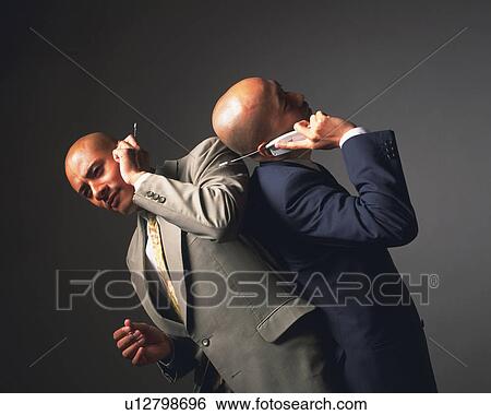 Two bald headed businessmen back to back and talking on mobile phones, Side View View Large Photo Image Stock Photograph - Two bald headed businessmen back to back and talking on mobile phones, Side View. Fotosearch