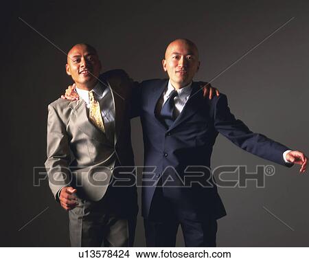 Two bald headed businessmen holding shoulders, Front View View Large Photo Image Picture - Two bald headed businessmen holding shoulders, Front View. Fotosearch