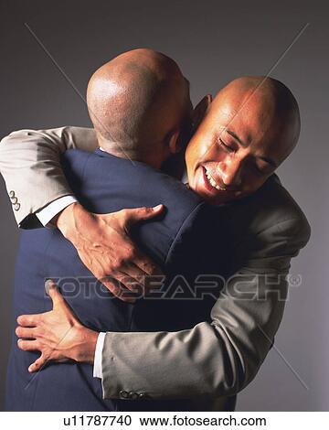 Two bald headed businessmen hugging, Front View, Rear View View Large Photo Image Stock Image - Two bald headed businessmen hugging, Front View, Rear View. Fotosearch