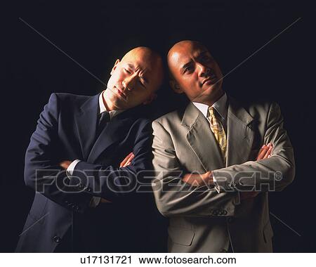 Two bald headed businessmen with crossed arms and leaning on each other, Front View View Large Photo Image Stock Image - Two bald headed businessmen with crossed arms and leaning on each other, Front View. Fotosearch