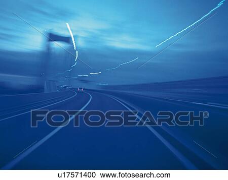 a Highway Under a Blue Sky, Front View, Blurred Motion, Toned Image, Long Exposure View Large Photo Image Stock Image - a Highway Under a Blue Sky, Front View, Blurred Motion, Toned Image, Long Exposure. Fotosearch