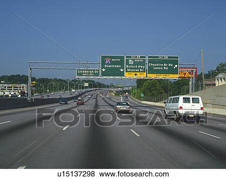 Stock Photo -  a Highway With Several Cars Driving on it, Front View. Fotosearch