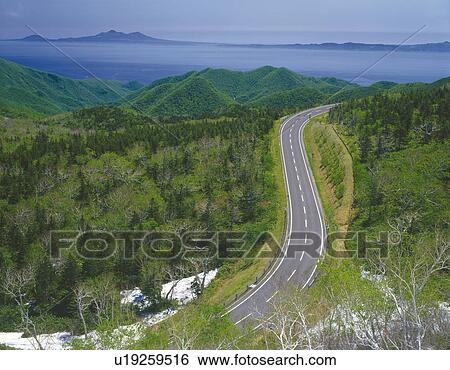 Stock Photograph -  a Little Mountain Path, Surrounded By Forests and Mountains, High Angle View. Fotosearch