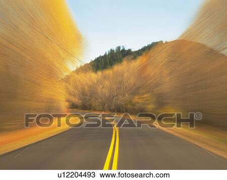a Mountain Path, Surrounded By Several Autumn-colored Trees, Front View, Blurred Motion View Large Photo Image Stock Image - a Mountain Path, Surrounded By Several Autumn-colored Trees, Front View, Blurred Motion. Fotosearch
