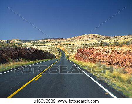 Stock Image -  a Mountain Path, Surrounded By Several Colorful Rocks and Hills, High Angle View. Fotosearch