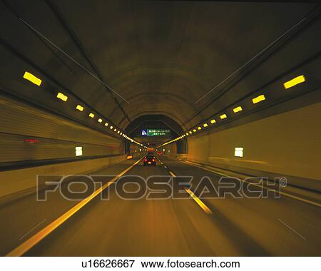 Stock Photo -  a Tunnel With a Lot of Lights Inside, Front View, Long Exposure. Fotosearch