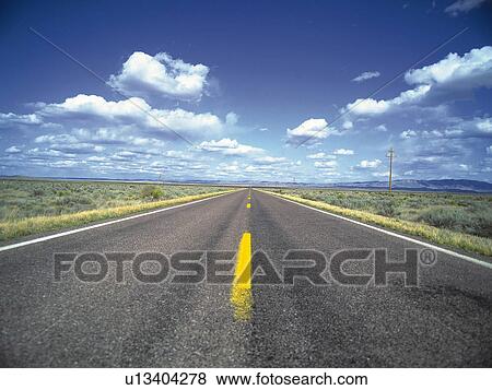 an Asphalt Road, Surrounded By a Huge Flat Land Under a Blue Sky, Front View View Large Photo Image Stock Photo - an Asphalt Road, Surrounded By a Huge Flat Land Under a Blue Sky, Front View. Fotosearch