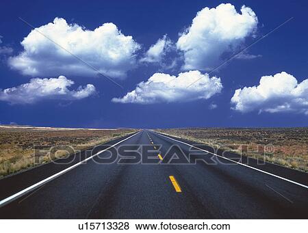 an Asphalt Road Under a Deep Blue Sky, Front View View Large Photo Image Stock Photo - an Asphalt Road Under a Deep Blue Sky, Front View. Fotosearch