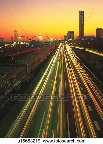 Highway By Sunset, Surrounded By an Illuminated City, High Angle View, Long Exposure, Tokyo Prefecture, Japan View Large Photo Image Stock Photo - Highway By Sunset, Surrounded By an Illuminated City, High Angle View, Long Exposure, Tokyo Prefecture, Japan. Fotosearch