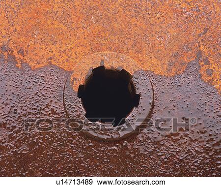 a Brown-colored Rusty Gear Covered With Oil, High Angle View View Large Photo Image Stock Photo - a Brown-colored Rusty Gear Covered With Oil, High Angle View. Fotosearch