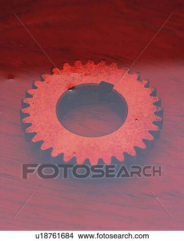 a Gear Covered With Red-colored Oil, High Angle View View Large Photo Image Picture - a Gear Covered With Red-colored Oil, High Angle View. Fotosearch