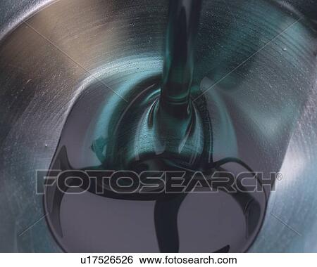 Blue and Grey Oil being Poured Into a Silvern Bowl, High Angle View View Large Photo Image Stock Photograph - Blue and Grey Oil being Poured Into a Silvern Bowl, High Angle View. Fotosearch