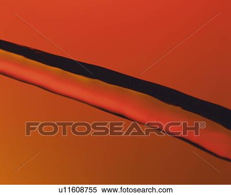 Stock Photography - Brown-colored Oil, Flowing, Side View. Fotosearch