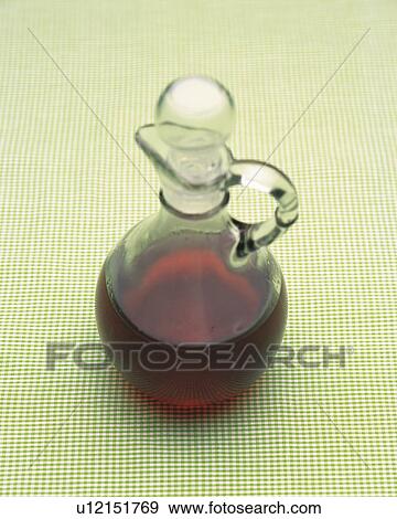 Brown-colored Oil in a Glass Bottle, High Angle View View Large Photo Image Stock Photo - Brown-colored Oil in a Glass Bottle, High Angle View. Fotosearch