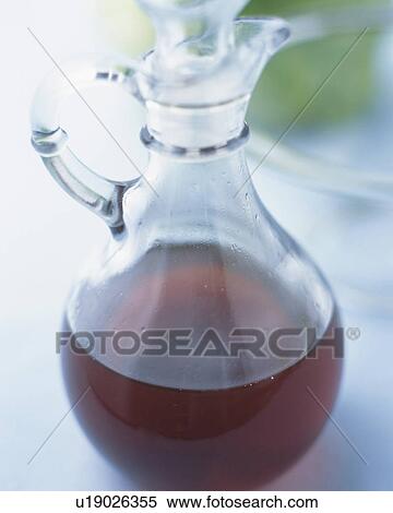 Brown-colored Oil in a Glass Bottle, High Angle View, Differntial Focus View Large Photo Image Stock Photography - Brown-colored Oil in a Glass Bottle, High Angle View, Differntial Focus. Fotosearch