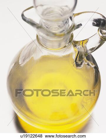 Closedd Up Image of a Round Glass Bin, Containing Yellow-colored Oil, High Angle View View Large Photo Image Stock Photo - Closedd Up Image of a Round Glass Bin, Containing Yellow-colored Oil, High Angle View. Fotosearch