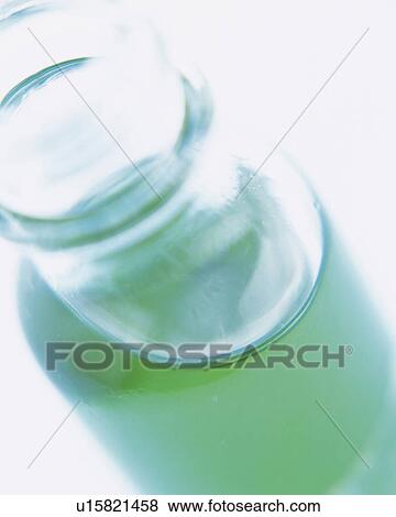 Green-colored Oil in a Small Glass Bottle, High Angle View, Differential Focus View Large Photo Image Stock Photo - Green-colored Oil in a Small Glass Bottle, High Angle View, Differential Focus. Fotosearch