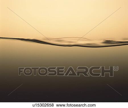 Grey Liquid, Making a Wave, Front View, Toned Image View Large Photo Image Stock Photo - Grey Liquid, Making a Wave, Front View, Toned Image. Fotosearch