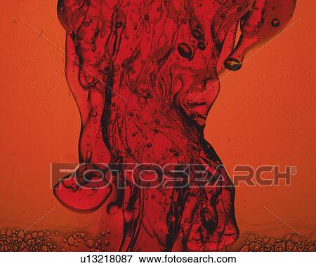 Red-colored Oil Being Poured View Large Photo Image Stock Photo - Red-colored Oil Being Poured. Fotosearch