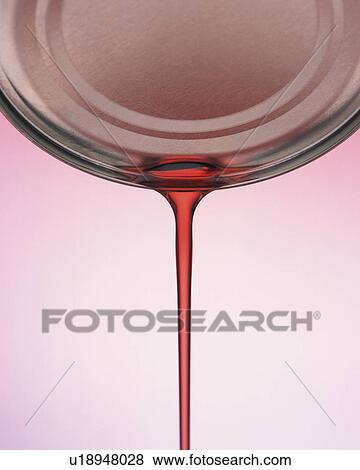 Red-colored Oil Flowing Out of a Silvern Can, Front View View Large Photo Image Stock Photo - Red-colored Oil Flowing Out of a Silvern Can, Front View. Fotosearch