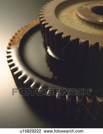 Stock Image -  Two Rusty Gears Covered In Oil, High Angle View, Differential Focus. Fotosearch