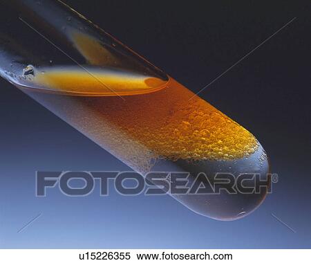 Stock Photography - Yellow-colored Oil, Light Partly Shining On it, High Angle View. Fotosearch