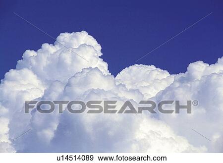 a Huge Cumulus Cloud Under a Deep Blue Sky View Large Photo Image Stock Photo - a Huge Cumulus Cloud Under a Deep Blue Sky. Fotosearch