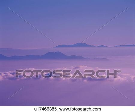 Stock Photography -  a Sea of Clouds With Several Mountaintops Showing, High Angle View, Soft Focus. Fotosearch